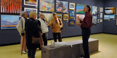 Group of people taking a talking tour at the Lambton Heritage Museum