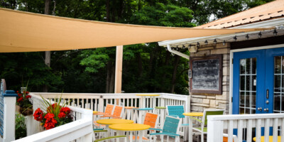 outdoor patio with colourful tables and chairs