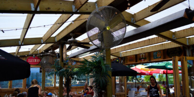 people eating on the patio at growling gator restaurant grand bend