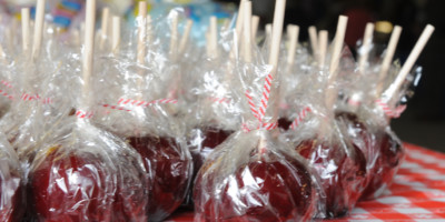 Close up of a table full of candied apples