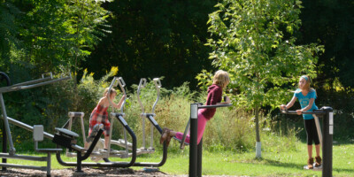 Kids on outdoor exercise equipment at Canatara Park Sarnia