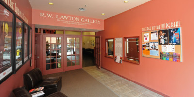 Seating and posters on display in the lobby of the Imperial Theater