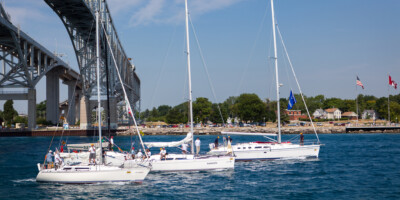 Sailboats going under the Bluewater bridge in the Mackinac Race