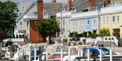 Houses along the water with boats parked on the dock