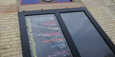 Poster in the window of Victoria Playhouse Petrolia