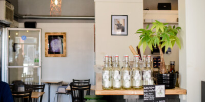 Kombucha bottles on display in a restaurant.