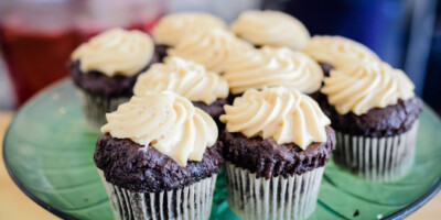 plate of decorated chocolate cupcakes
